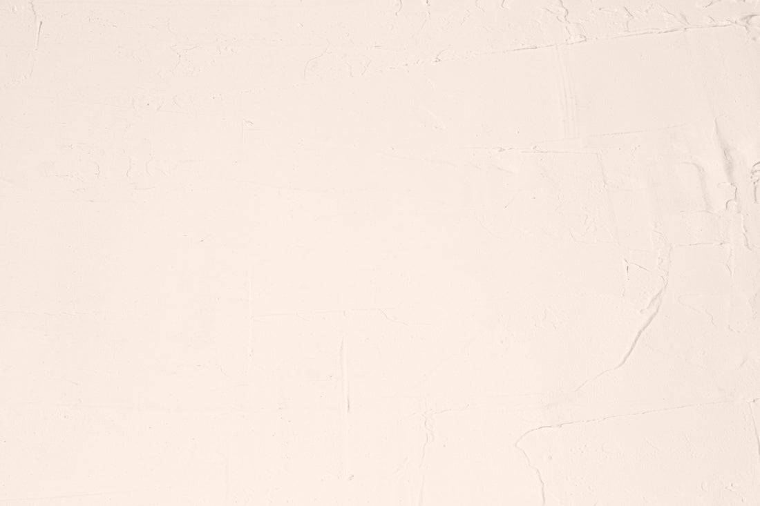 A white sheet with a black cat sitting on top of it